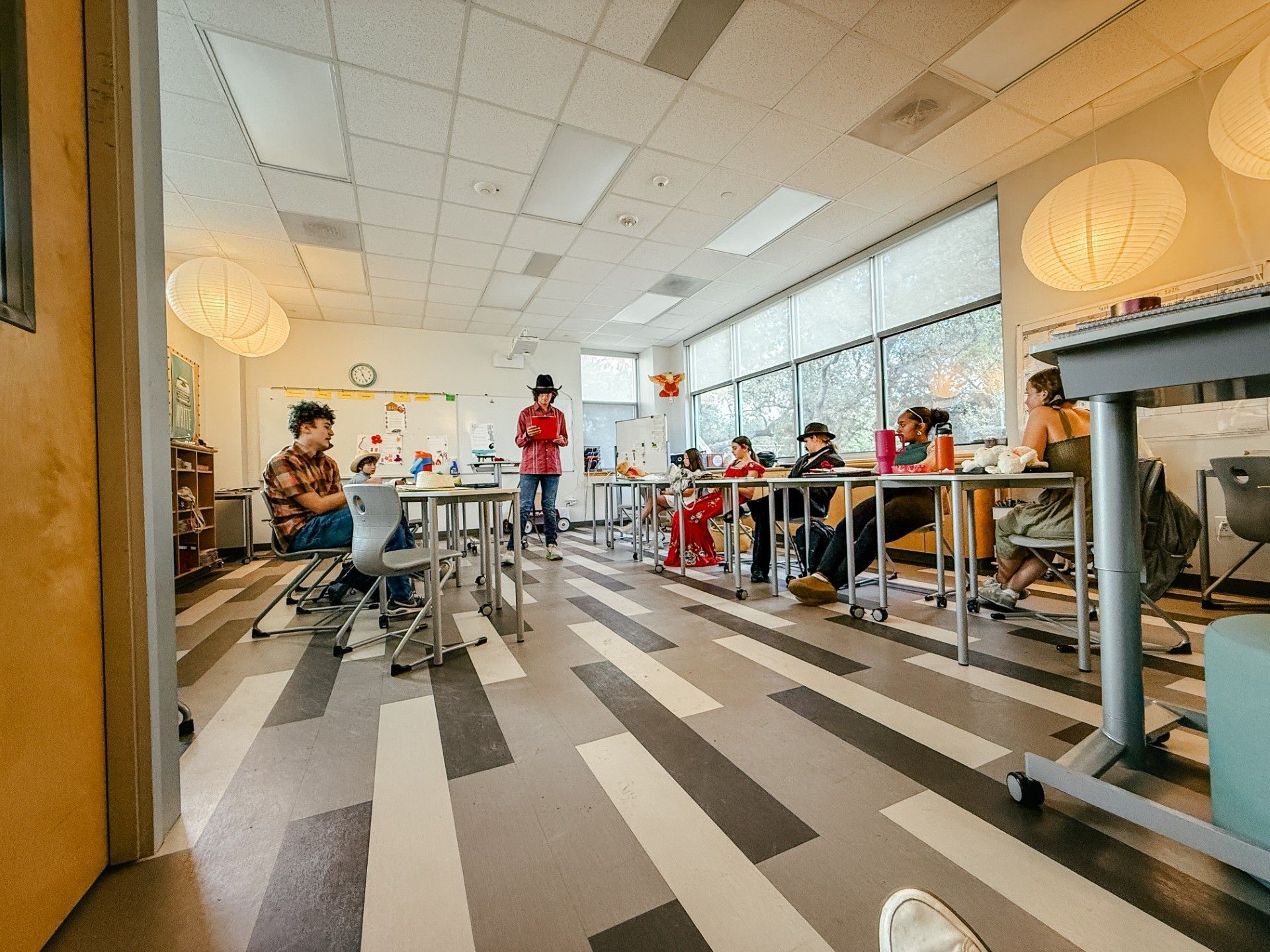 Class of 10 presenting Animal Farm monologues. Students are dressed in character.