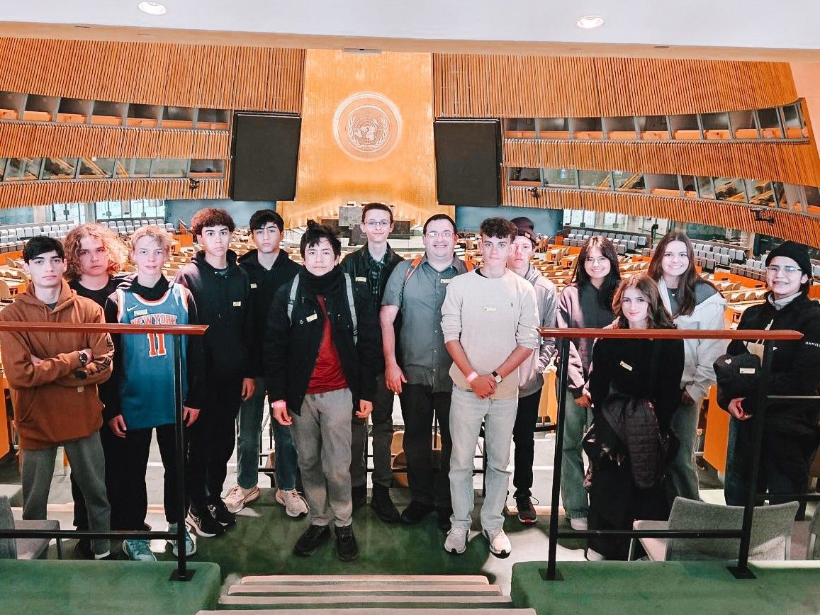 Group picture in the General Assembly Hall of the United Nations building.
