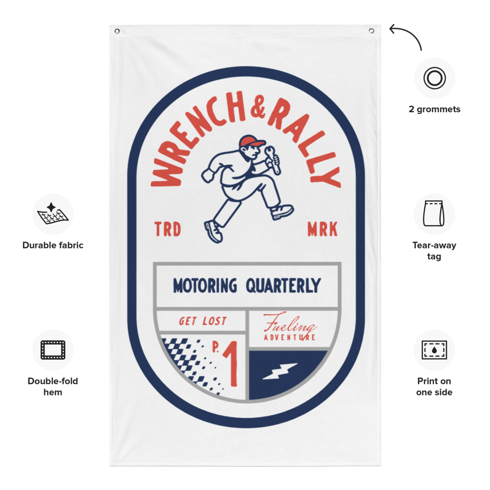 A man is hanging a banner that says wrench & race