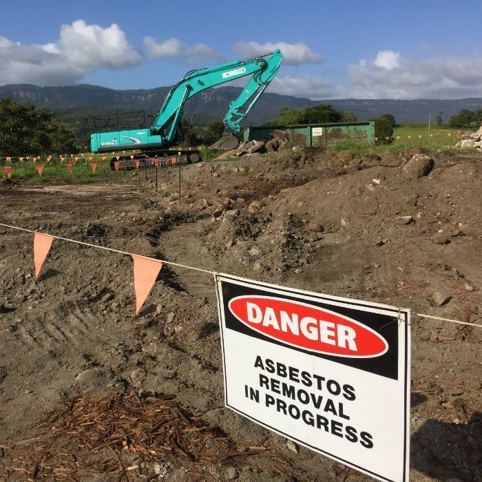 tractor removing asbestos