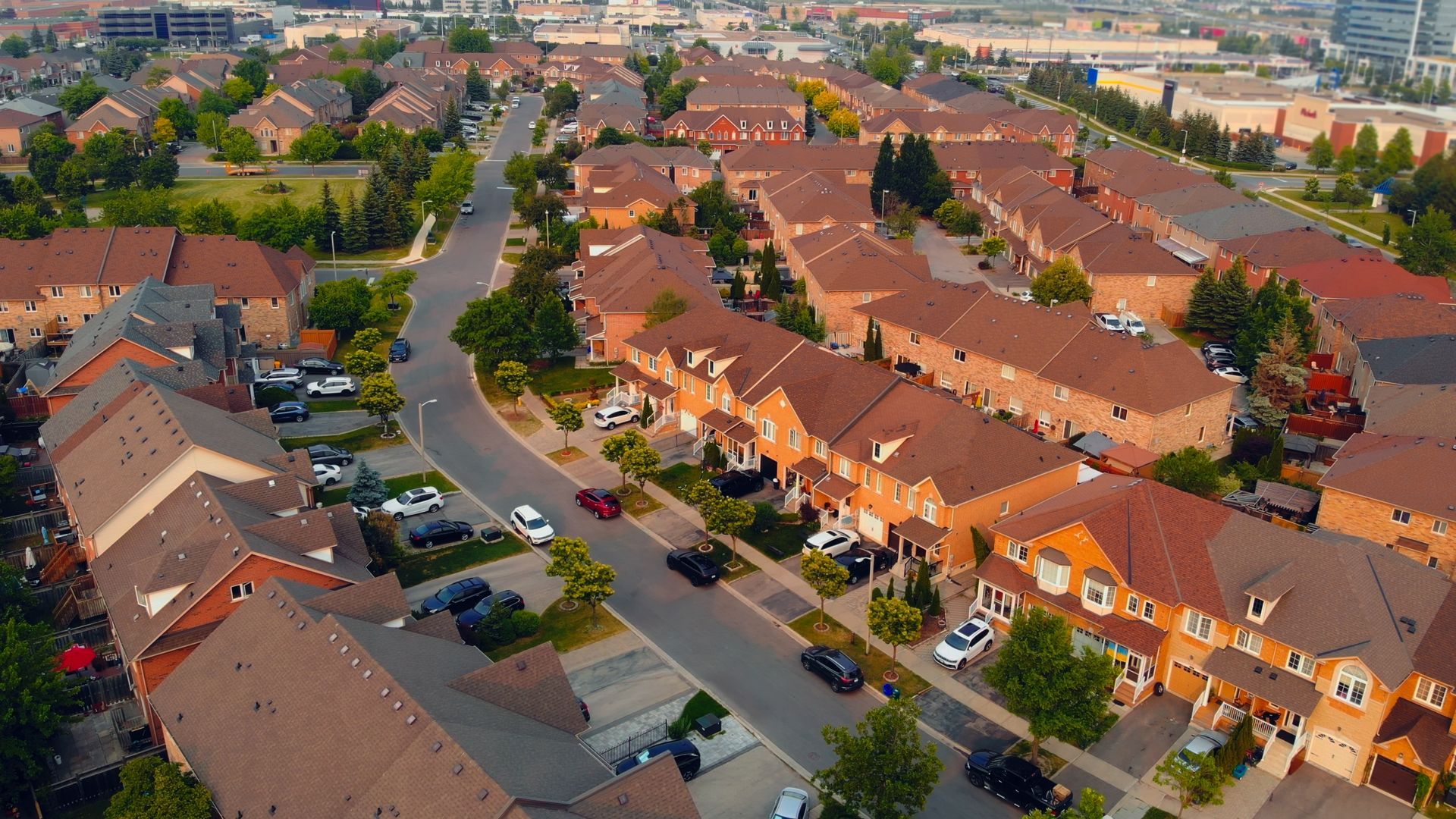 An aerial view of a residential area with lots of houses and trees.