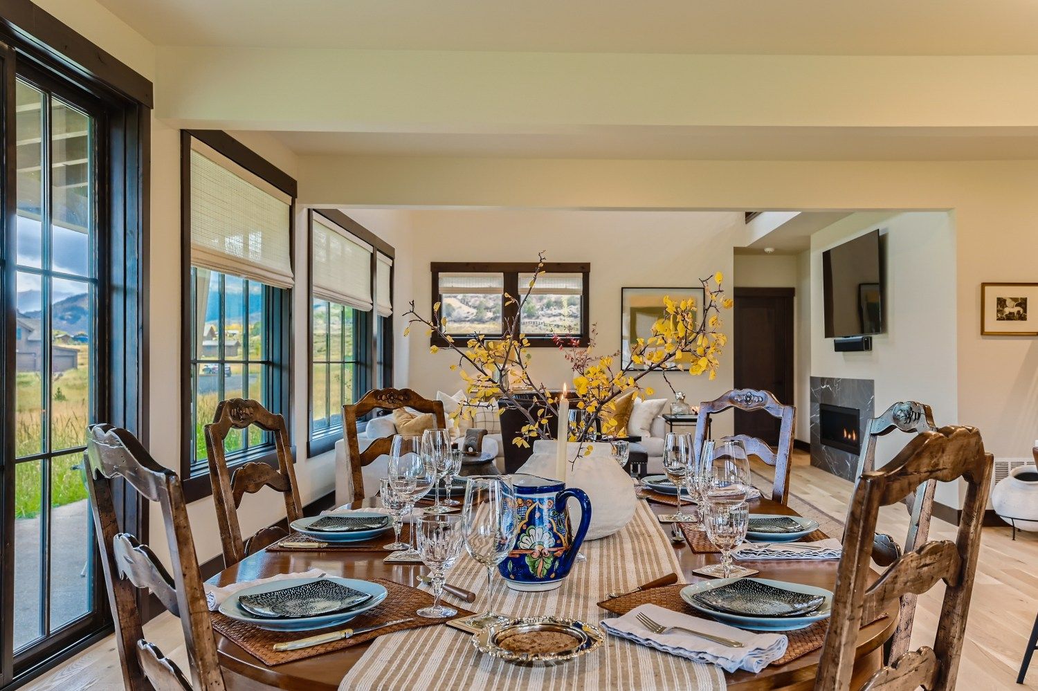 Pink snap dragons with a pink gift wrapped present on a porch