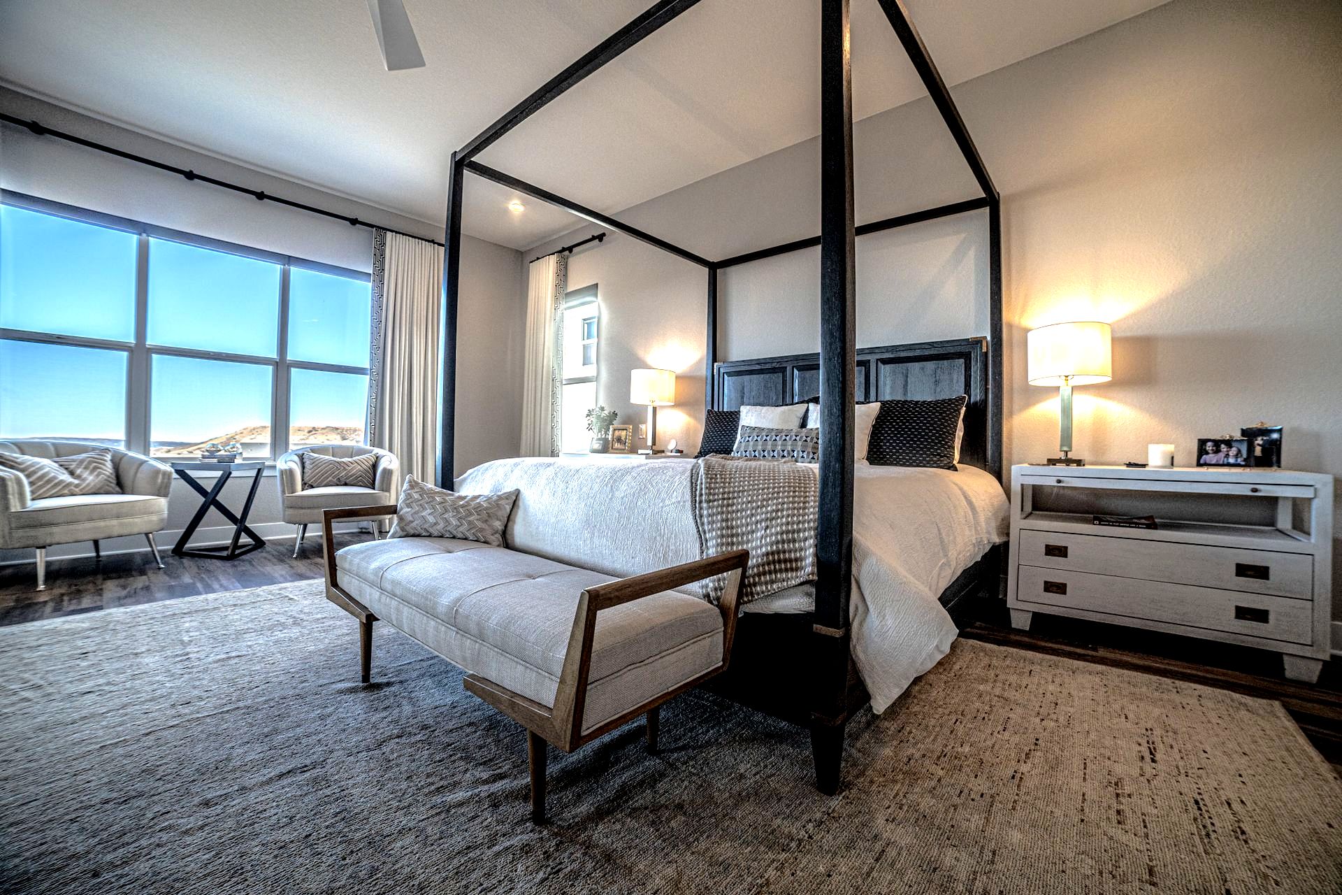 Pink snap dragons with a pink gift wrapped present on a porch