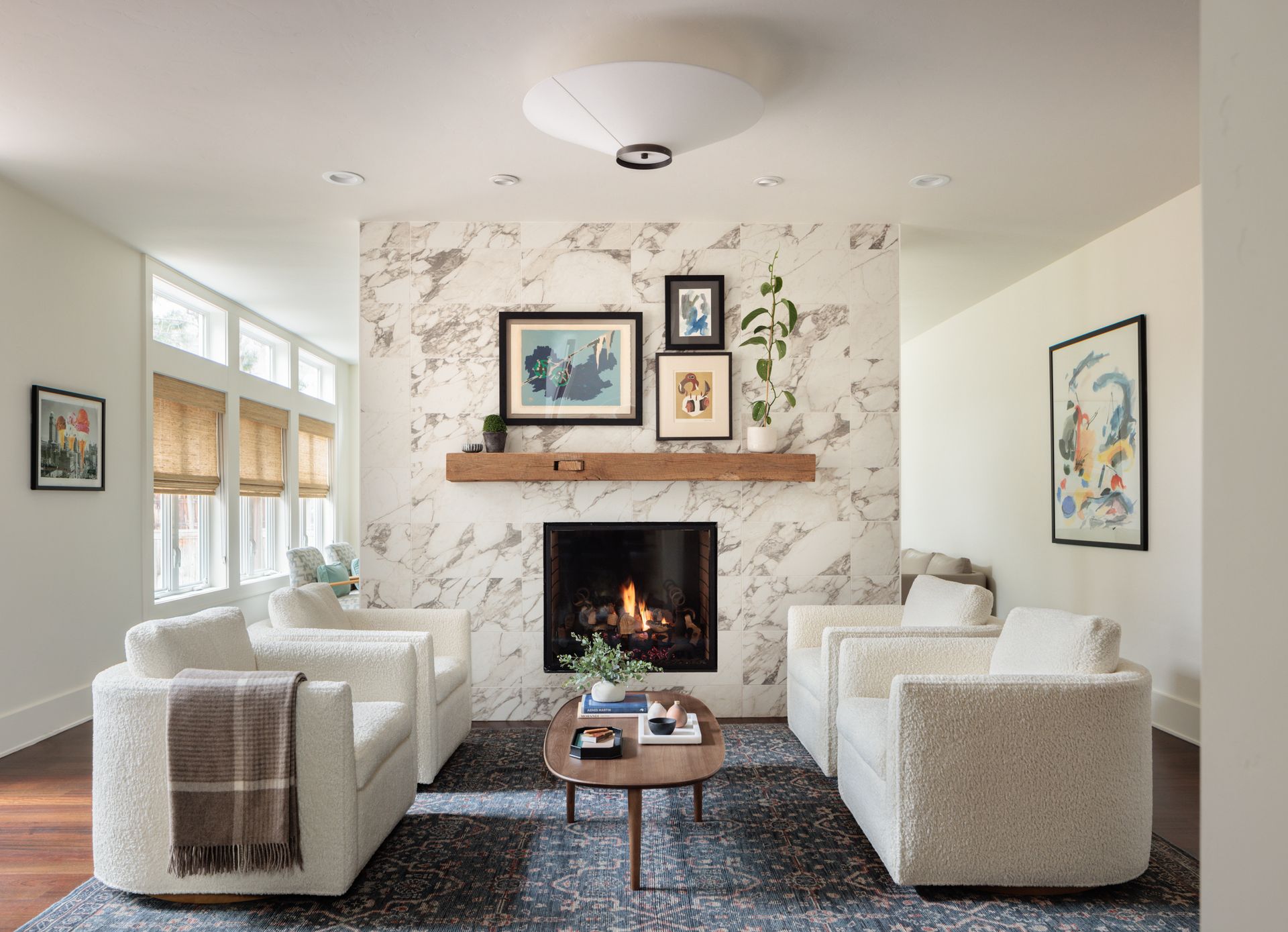 There is a fireplace in the middle of the living room.
