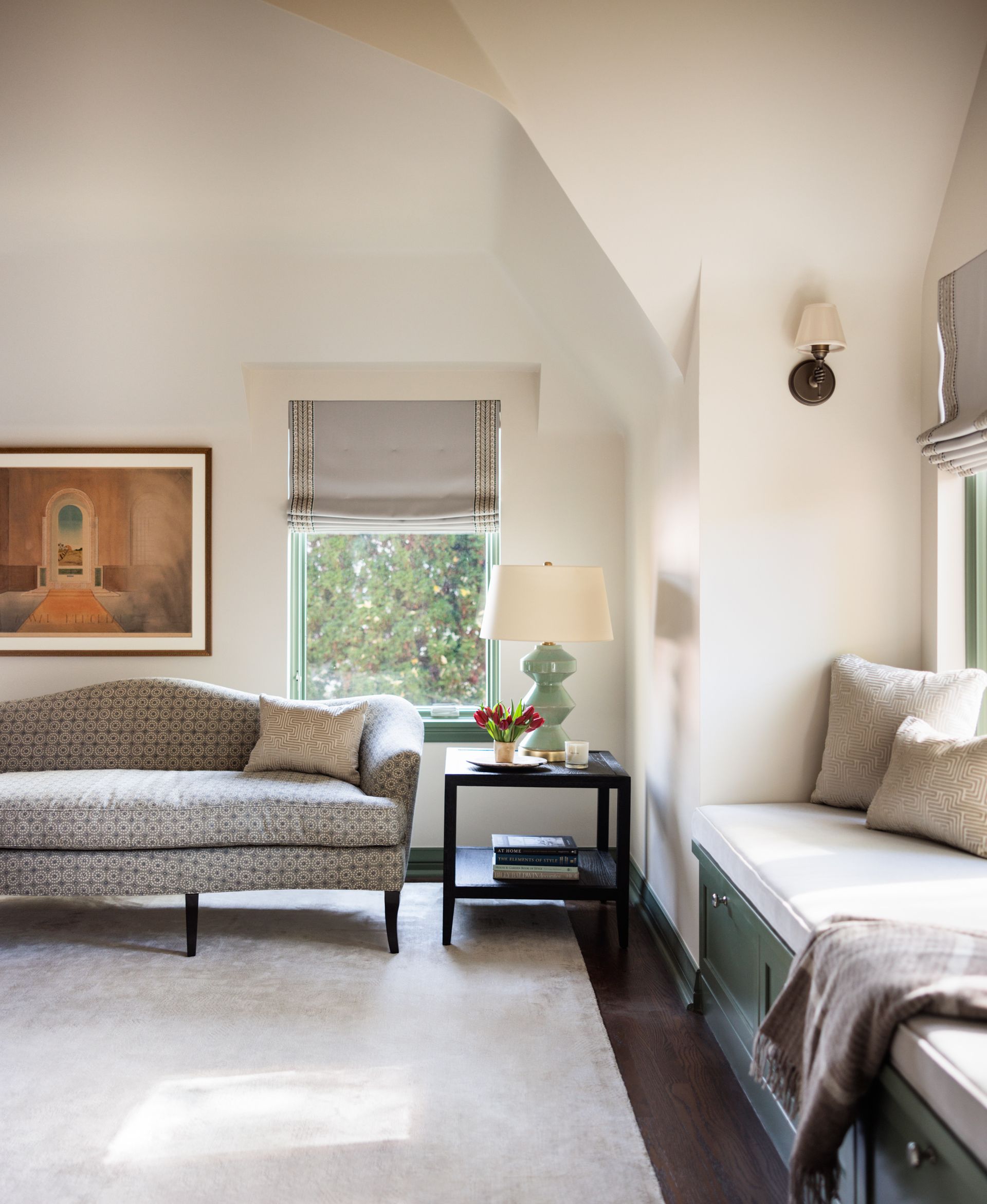 A living room with a couch and a window