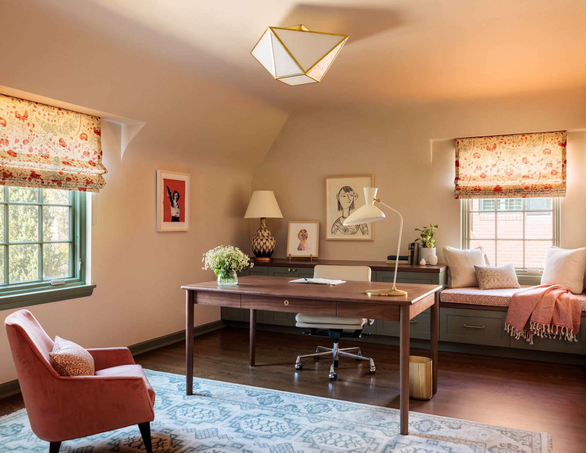 A home office with a desk , chair , and window seat.