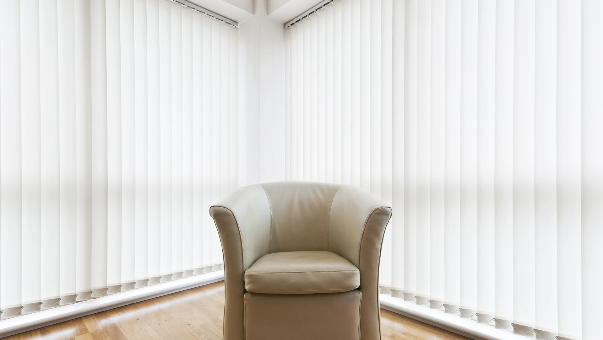 woman cleaning wooden blinds