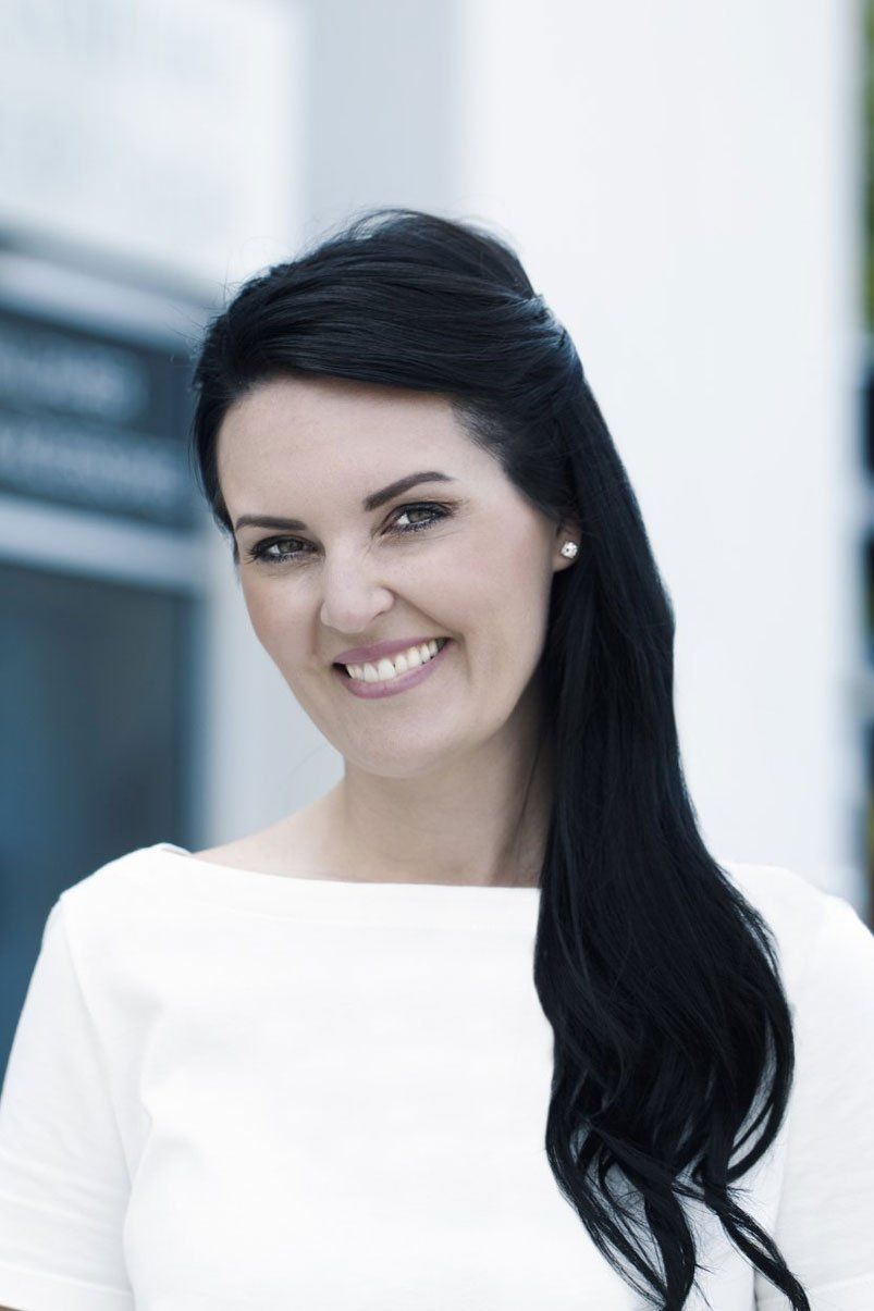 roman shades in the bathroom with blue wallpaper
