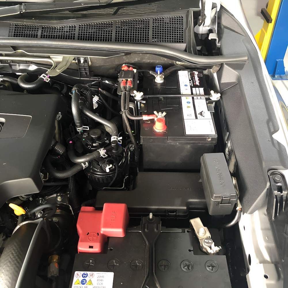 The Inside of a Car With the Hood Open and the Battery Visible — Kawana Auto Service In Warana, QLD