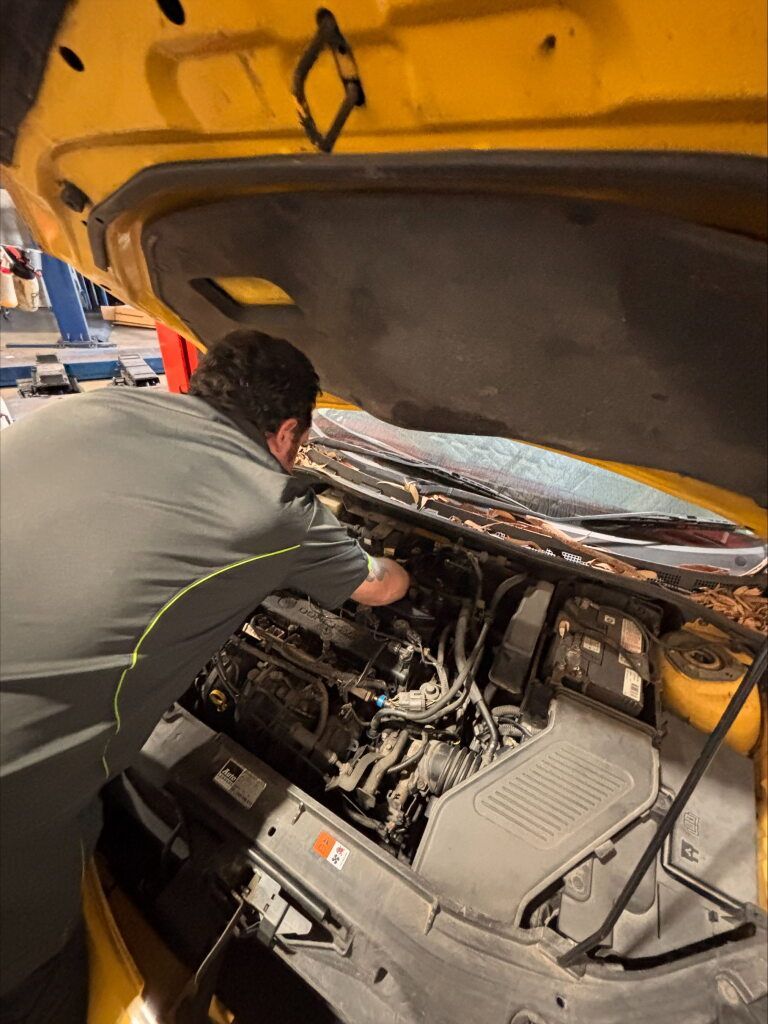A Man is Working on a Car Engine — Kawana Auto Service In Warana, QLD