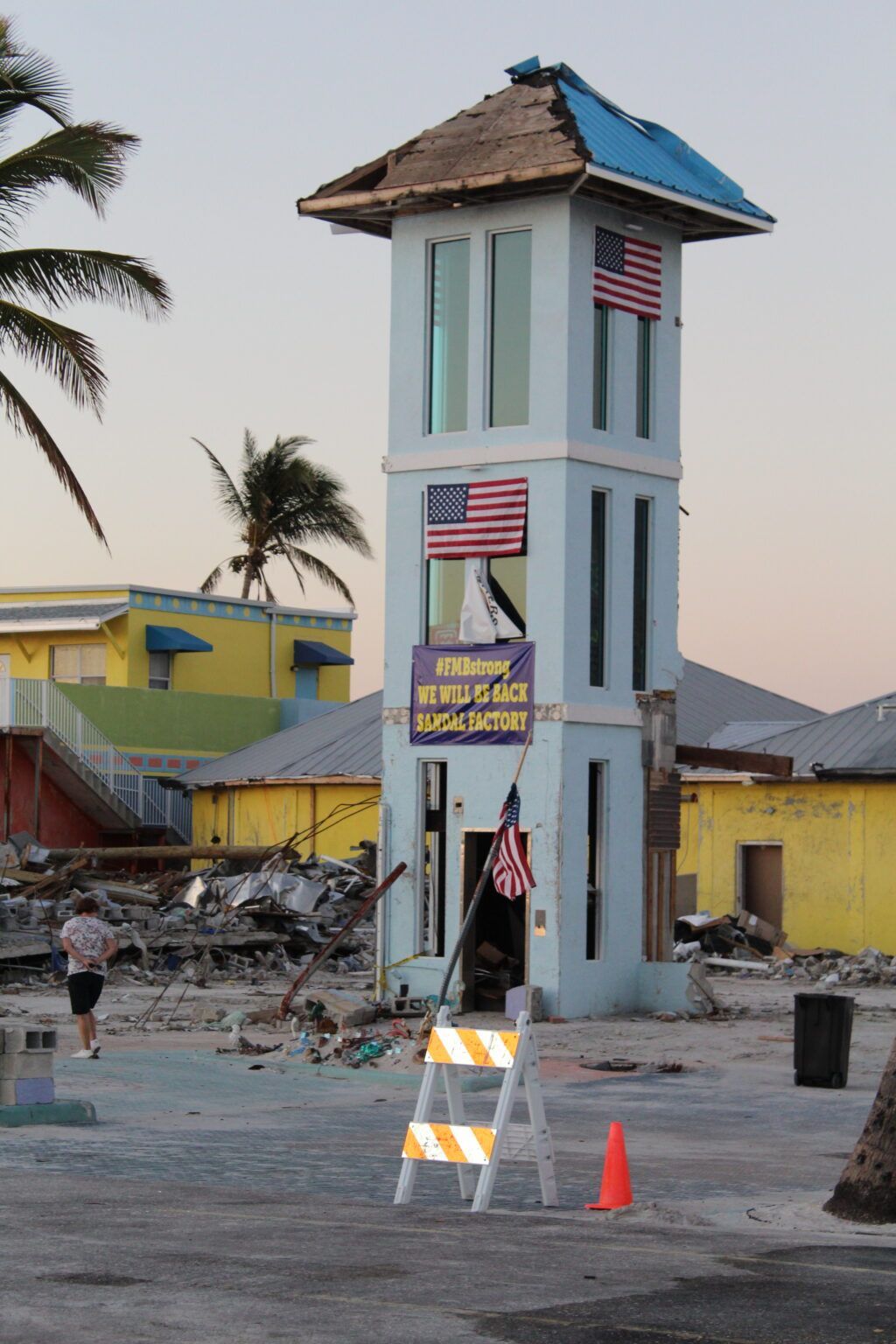 A tower with a sign on it that says