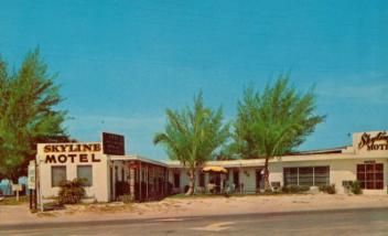 A motel with a sign that says skyline motel on it