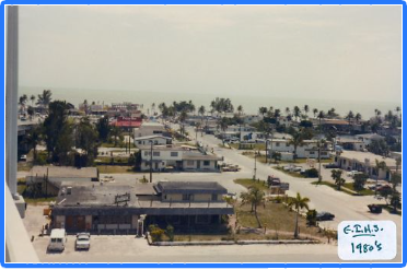 A black and white photo of a residential area from the 1990 's