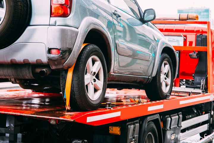 A Car Is Being Towed By A Tow Truck - Sanford, NC - Landmark Towing of Sandford