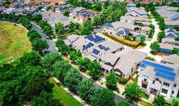 An aerial view of a residential area with lots of houses and trees.