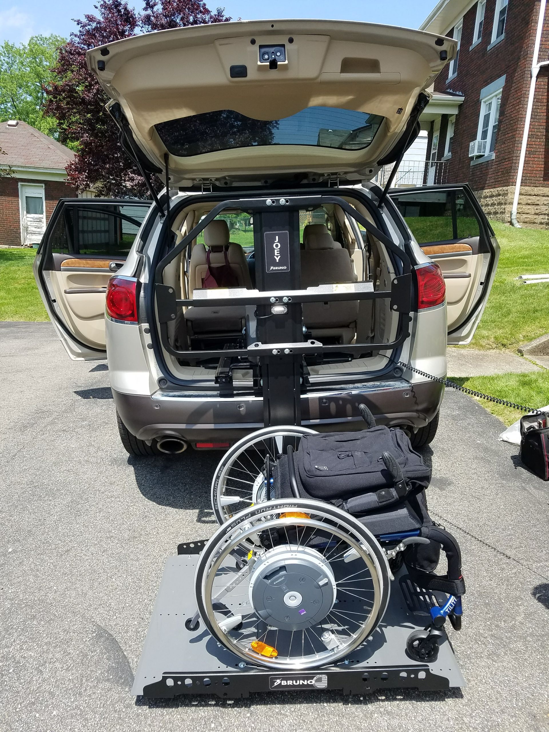 A wheelchair is sitting in the back of a car.