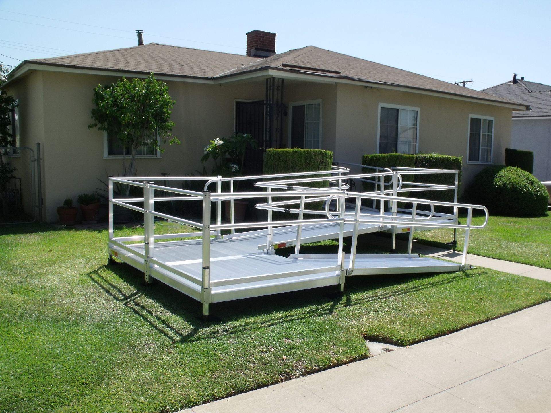 A wheelchair ramp is sitting in front of a house