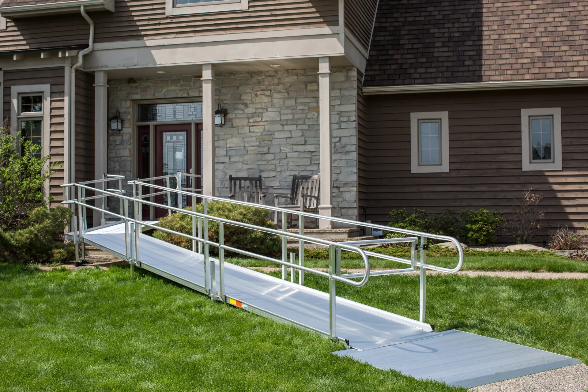 A wheelchair ramp with an angled platform installed by Altamira Ltd.