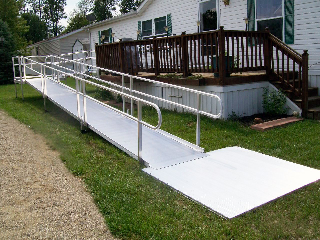 A ramp leading to a deck of a mobile home