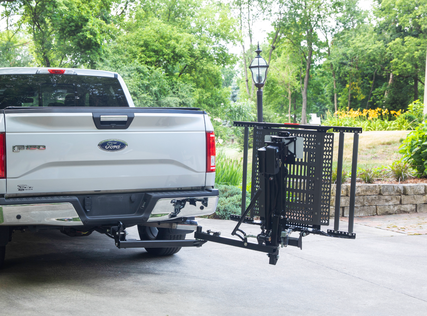 A ford truck with a bike rack attached to the back of it
