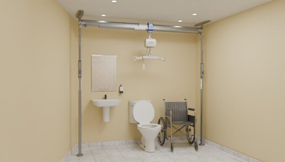 Accessible bathroom with ceiling lift, wheelchair, toilet, sink, and mirror. Light beige walls and floor.