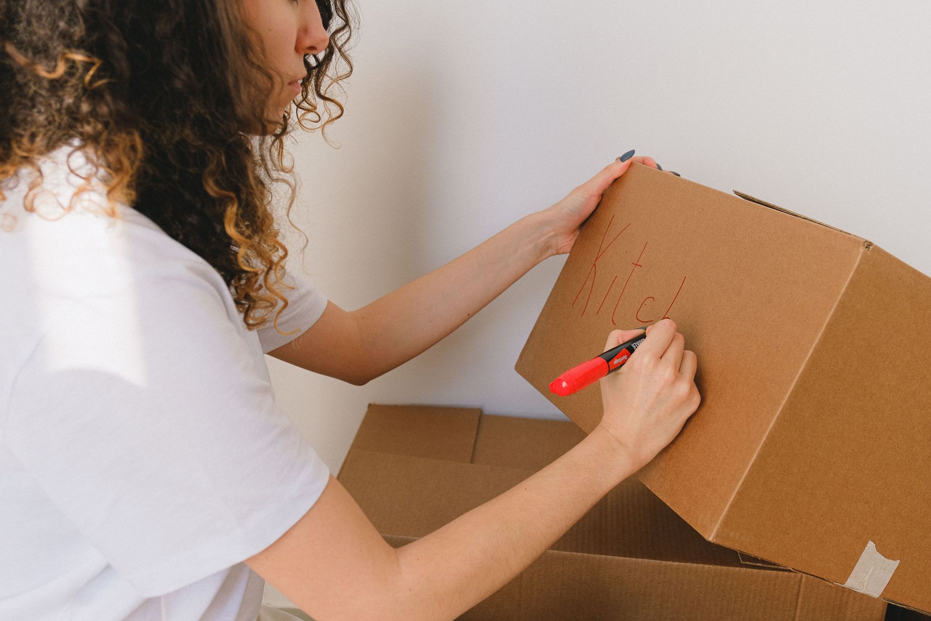 Woman packing a box for a self storage unit in Zachary, LA