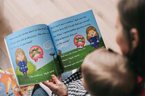 Family reading Myla Gets to the Root Children's Illustrated Book