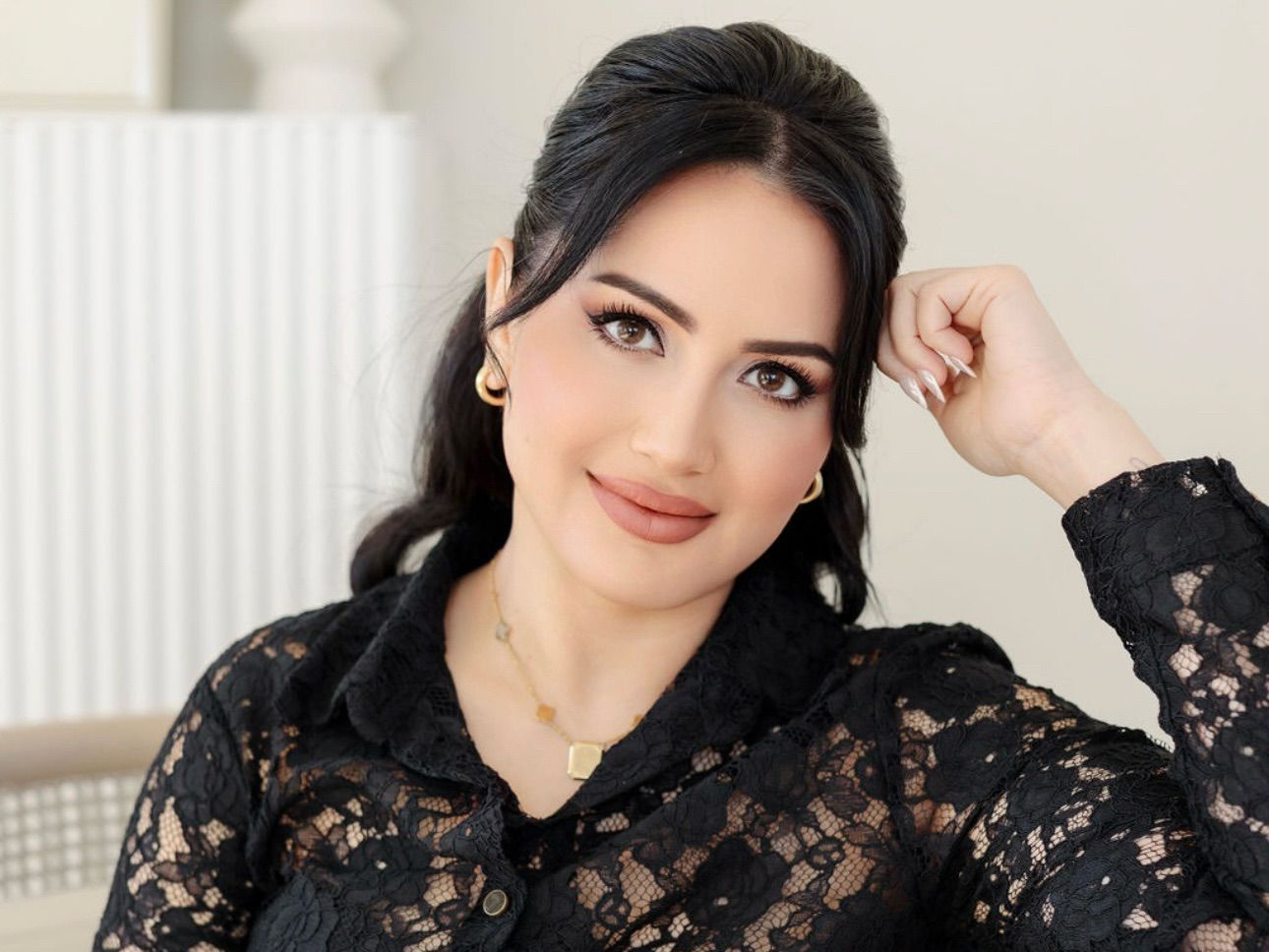 Three women are standing next to each other with their eyes closed.