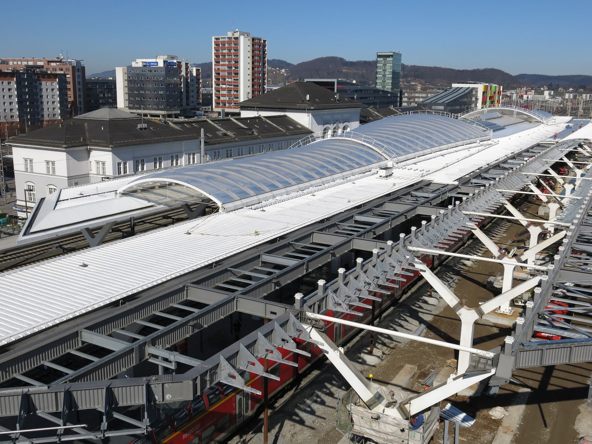 An aerial view of a train station under construction