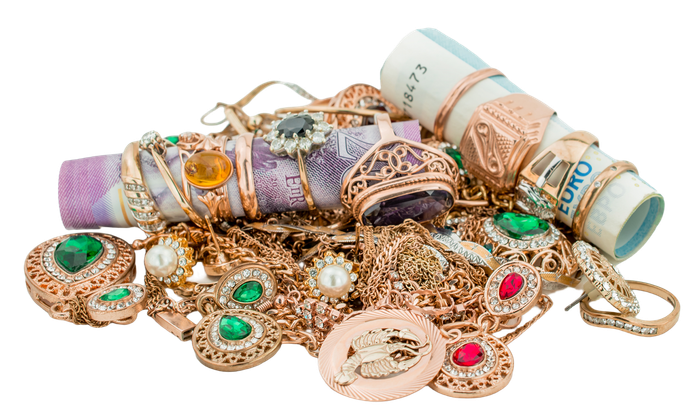 Pile of assorted gold and jeweled bracelets and rings in pastel pink, lavender, and mint tones