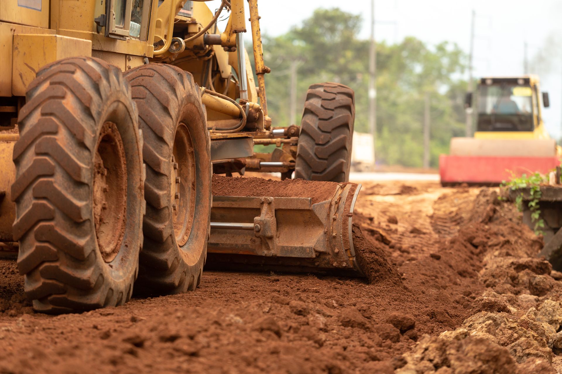 A bulldozer is moving dirt on a construction site.