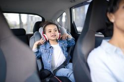 Kid With Headphones While Mom Is Driving — Camp Douglas, WI — C. L. Chase 24 Hour Towing & Recovery