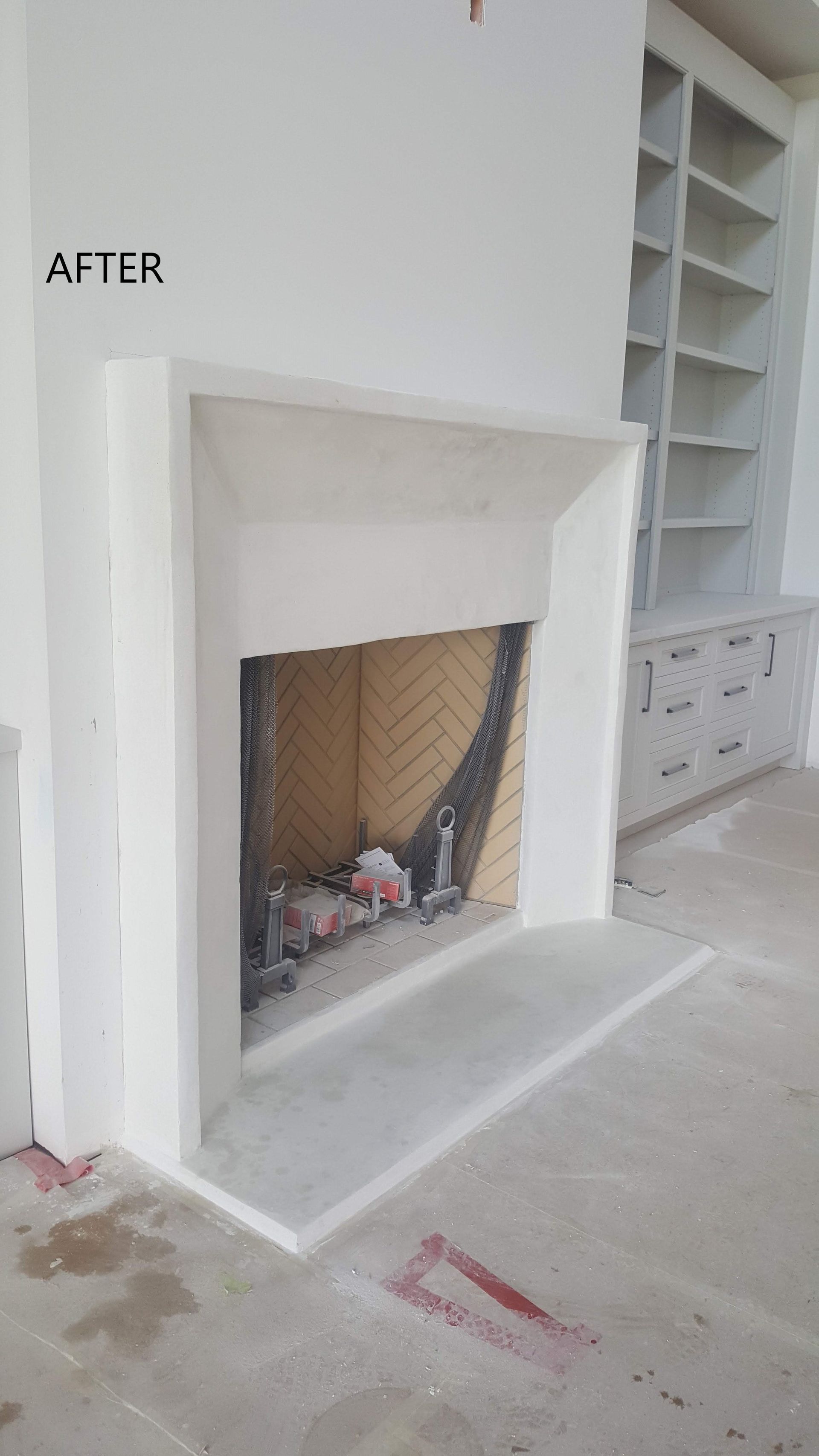 A fireplace in a living room with a sign above it that says `` after ''.