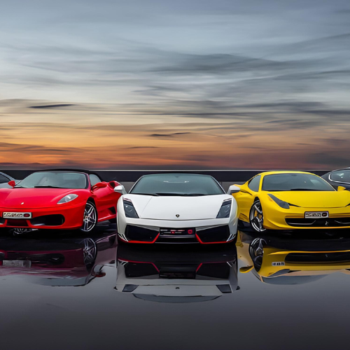 A row of boats are docked on a dock in the water.