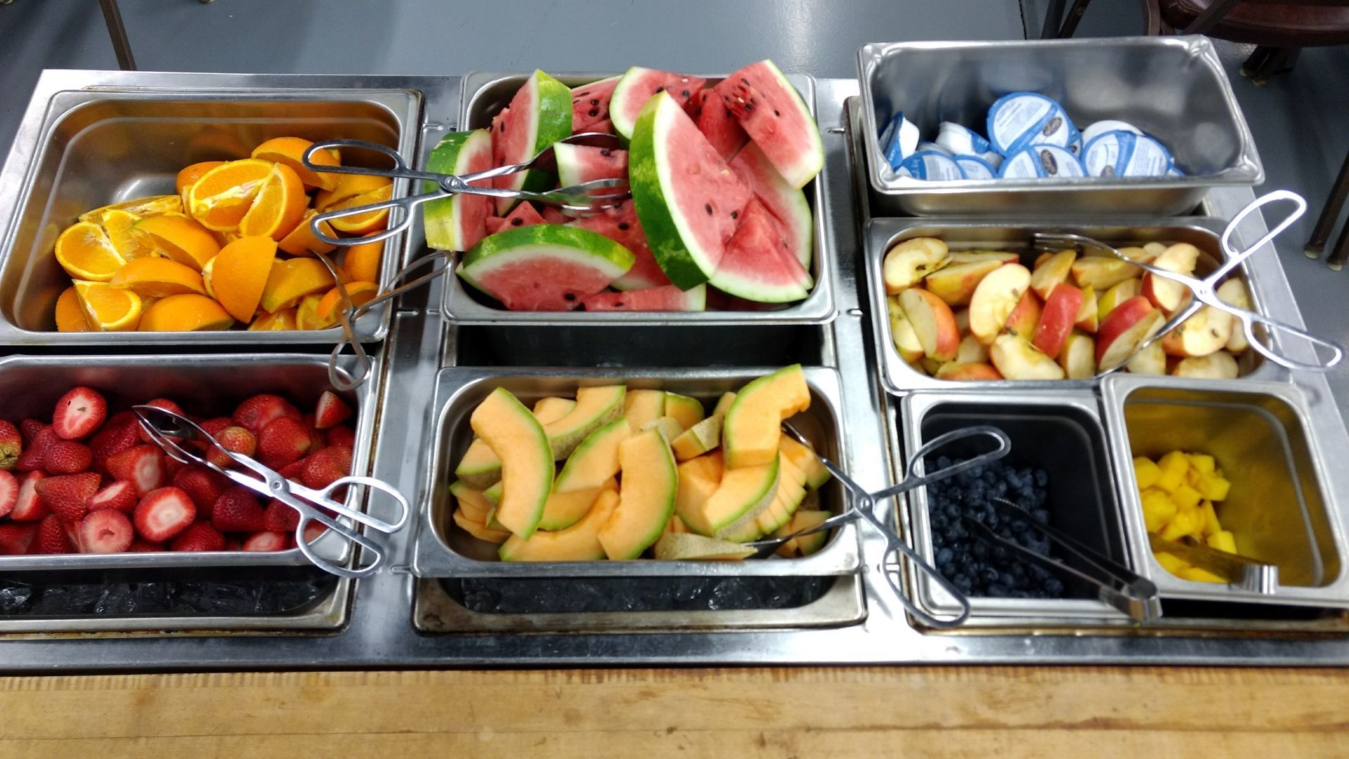 There are many different types of fruit on the buffet.