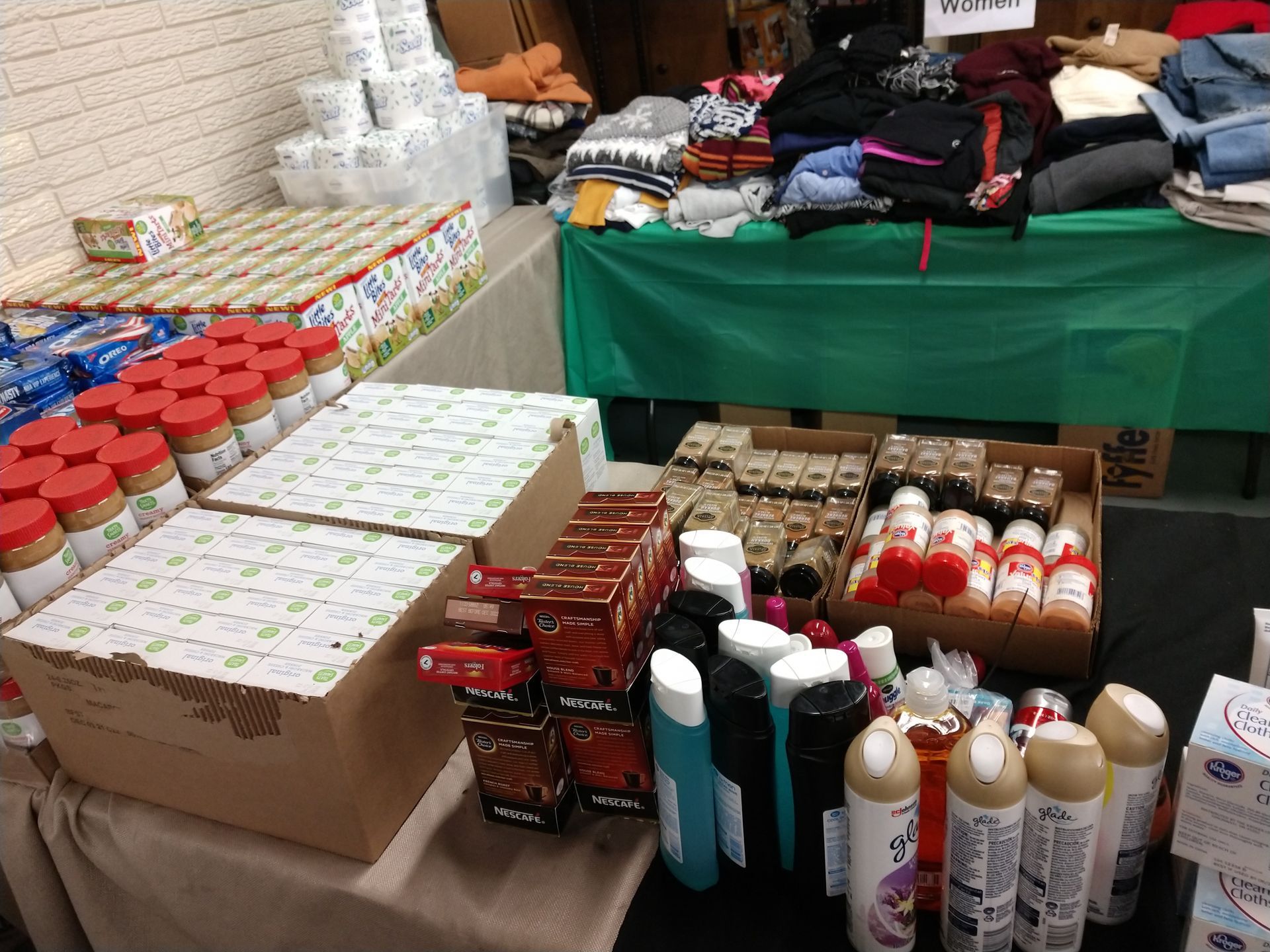 A table with a lot of bottles and boxes on it