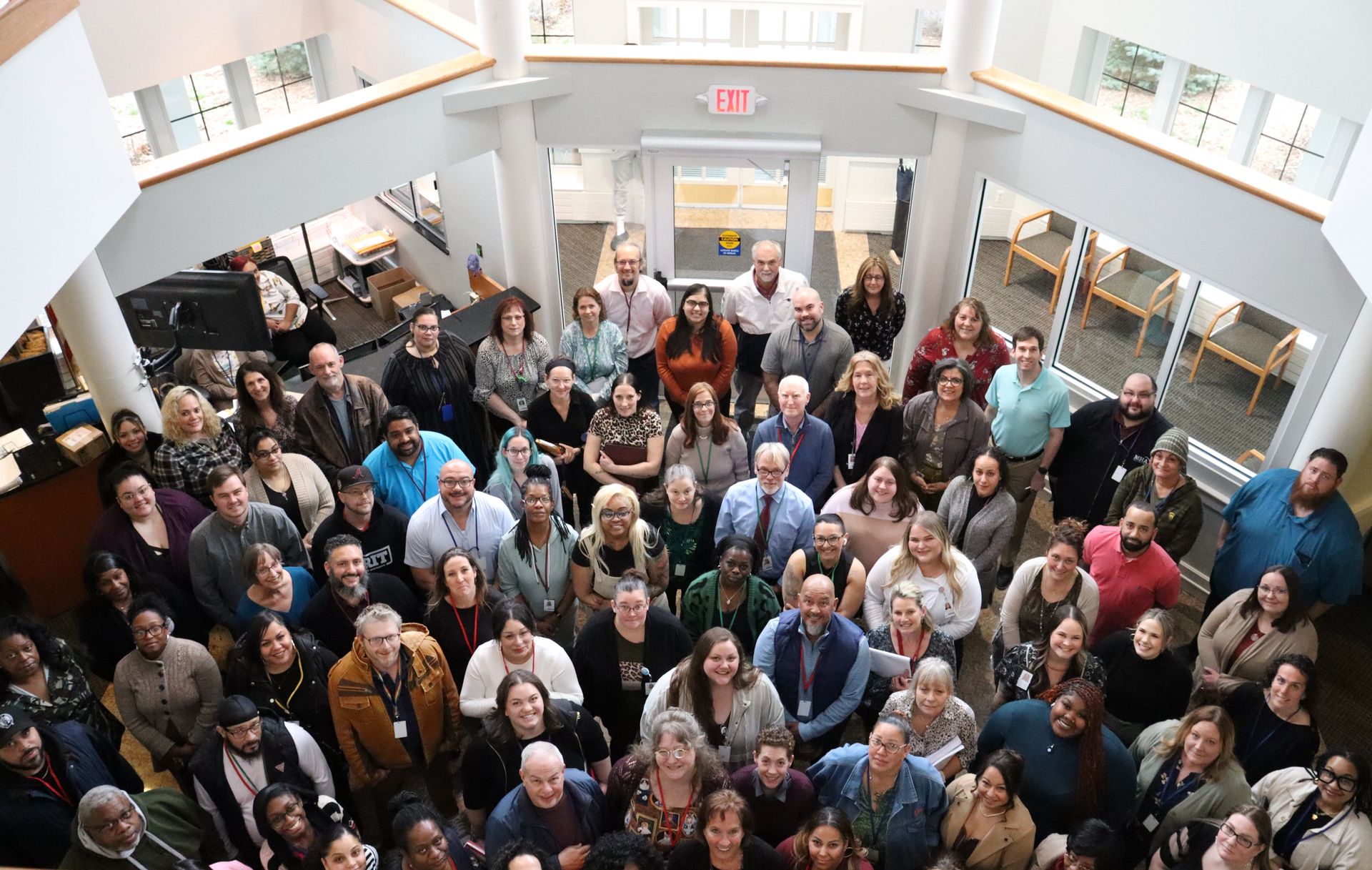 A large group of people are posing for a picture in MHA main office
