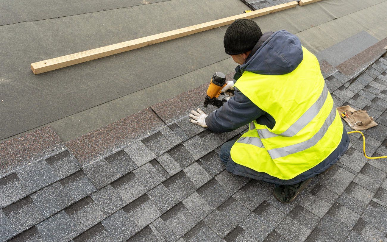 Man Installing Shingles on Roof — Jacksonville, FL — Joe Turner Roofing