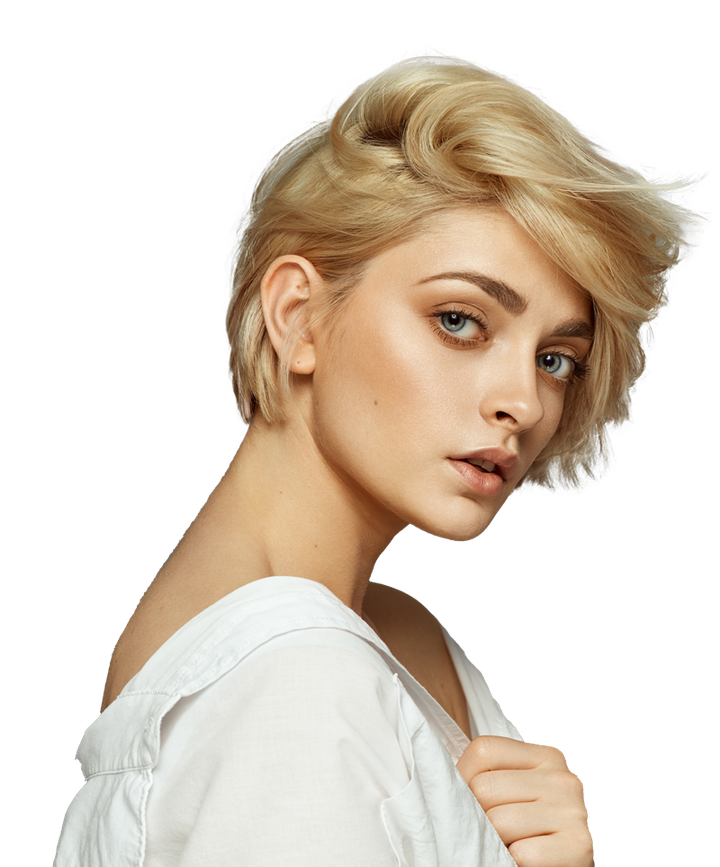 A woman with short blonde hair is wearing a white shirt and looking at the camera.