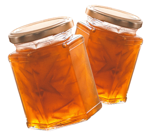 Two tilted jars filled with orange jelly, each with a gold lid.
