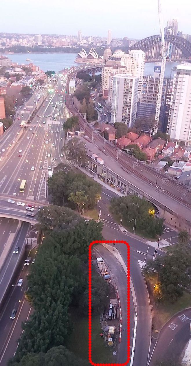 An aerial view of a city with a red circle in the middle
