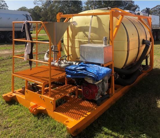 A large yellow tank is sitting on top of an orange platform