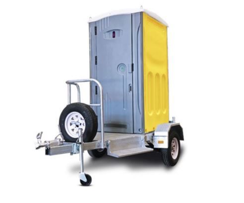 A portable toilet is attached to a trailer.