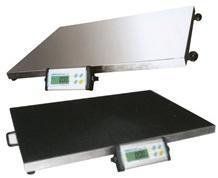 Two flat, rectangular industrial scales; one stainless steel, one black, with digital displays.
