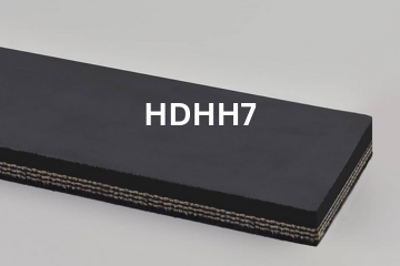 Heavy Duty Grade 2 belting labeled HDHH7 with description of 3-PLY 330# PIW Black 3/16 Top Cvr X 1/16 Bot. Cvr PEAK HR 700°F
