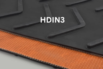 Black conveyor belt with orange fabric edge and 