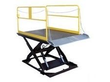 Yellow and black scissor lift platform with guardrails.