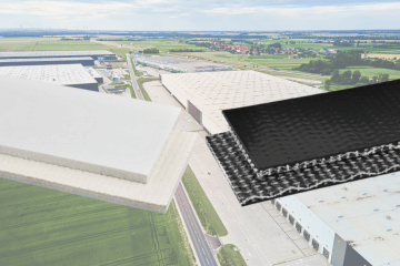 PVC conveyor belts (one white and one black) on the background of a large warehouse complex.