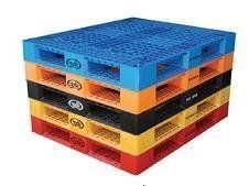 Stack of colorful plastic pallets: blue, orange, black, yellow, red.