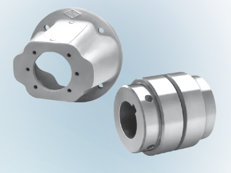 Two metal machine coupling parts, one with a flange, the other a cylindrical sleeve, on a blue background.